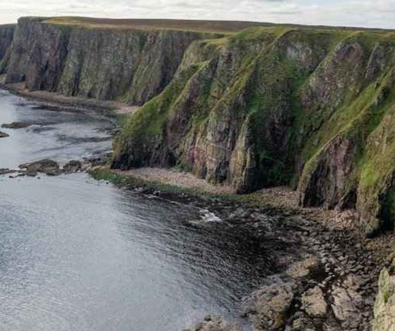 The nomadic boys gay travel bloggers at the Duncansby Stacks in Caithness, Scotland