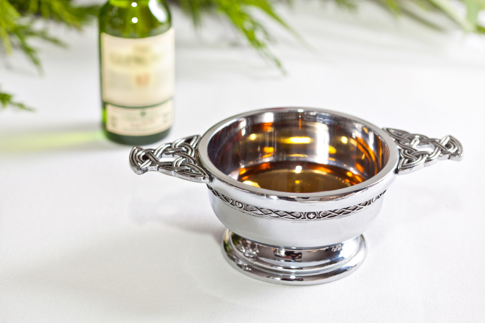 Traditional Scottish quaich and bottle of whisky