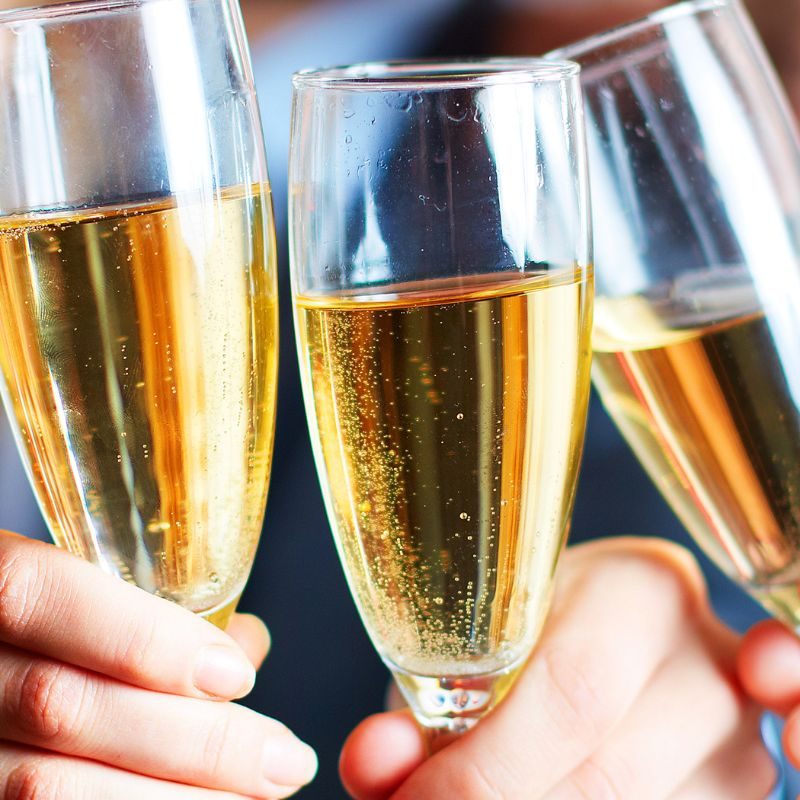 Three business partners toasting with champagne