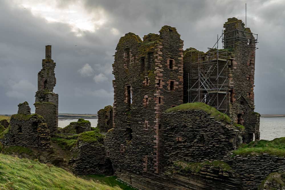 The dramatic ruined Castle Sinclair Girnigoe on a cloudy day. 