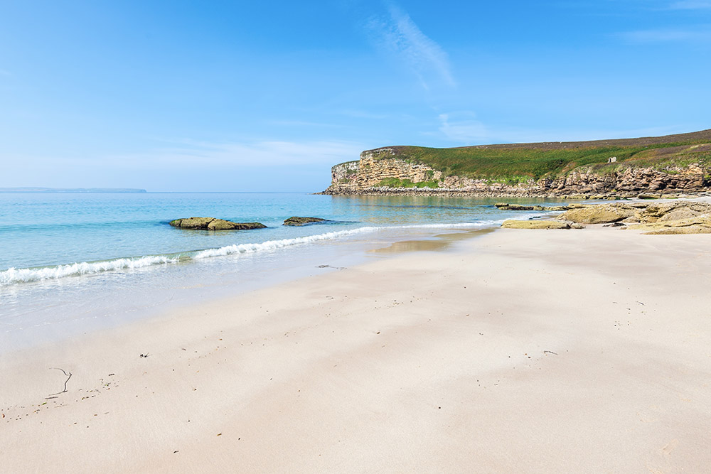 The white beaches and blue sky at Peedie Sands.